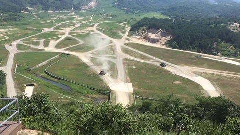 A tank fires round downrange during Table VI Gunnery - 2018 Stock Footage 106235177