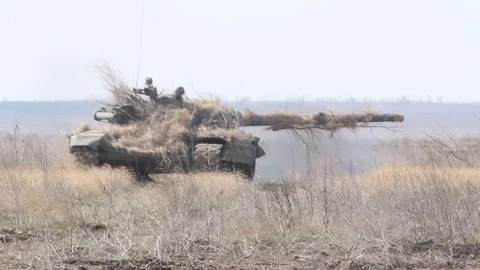The tank goes to the side of the fighting.Real footage of the war in the Donb Stock Footage