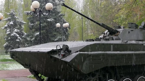 On the tank, installed as a pendulum in the park, the snow falls Stock-Footage 85287995