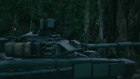 Tank located in dense jungle environment during military exercise Stock Footage 324034338