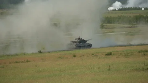 Tank moving quickly in an open field Stock Footage 110795778