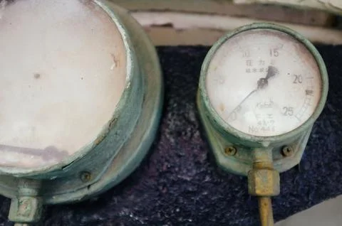 Tank pressure reader dials in engine room of Japanese steam locomotive train Stock Photos
