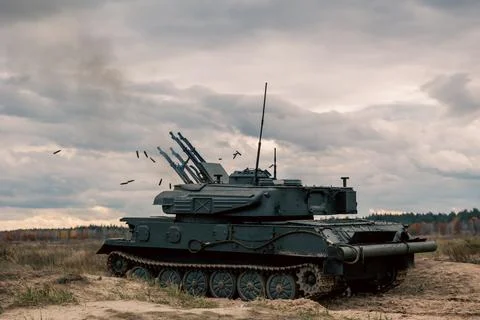 The tank is rolling and the shells are flying Stock Photos