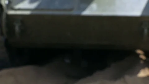 A tank of the second world war rides across the sand. Not in focus. Stock Footage 76745082