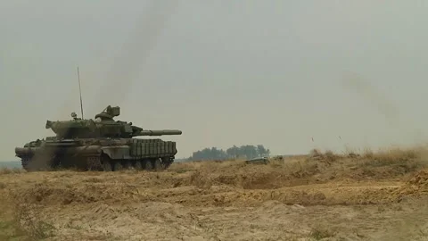 The tank stands on sandy ground and is aimed at the target with a muzzle. Stock Footage 314094346