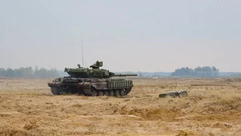 A tank is started at the training ground, ready to go on a combat mission. Stock Footage 319418756