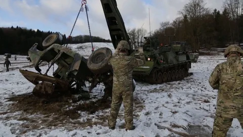Tank uses crane to flip an upside-down vehicle Stock Footage 110795562