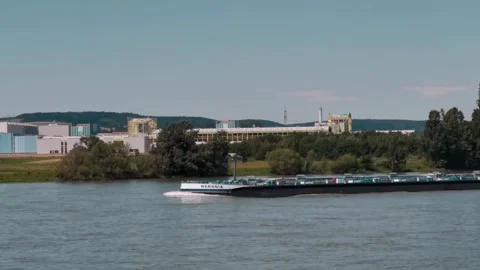 A tanker barge navigating the Rhine river on a sunny day Stock Footage 320723952