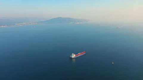 Tanker loaded with parcels floats on the backdrop of scenic shores Video stock 140575473