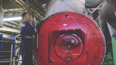 Tanker second mechanic repairs large industrial equipment Video stock 133036769