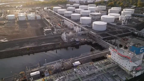 Tanker ship unloading at port, import export oil and gas petrochemical Stock Footage 241952983