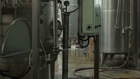 Tanks in the plant for fruit processing,juice production factory, tilt up by Cut Stock Footage 69152549