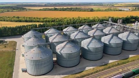 Tanks of storage elevator for processing and storage of soybean and wheat grain Video stock 219464032