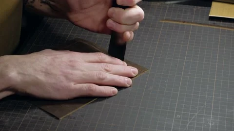 Tanner cuts leather close up. Video stock 149472312