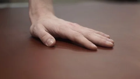 Tanner pats the leather. Close-up Stock Footage 104927352