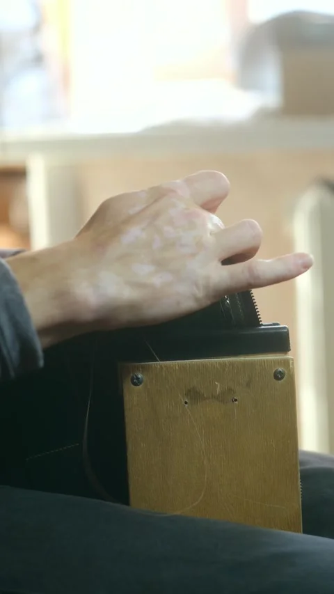 Tanner threading needle while making leather wallet Stock Footage 296747887