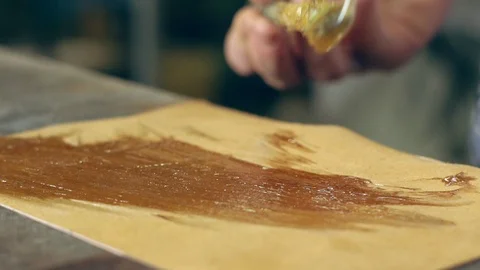 Tanner at work in the workshop Stock Footage 99772720