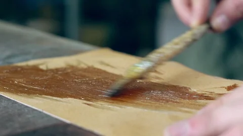 Tanner at work in the workshop Stock Footage 99906454