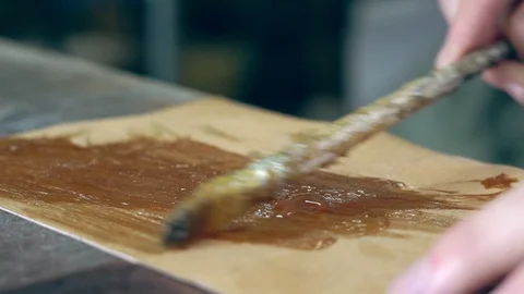 Tanner at work in the workshop Stock Footage 103839519