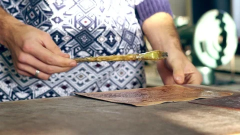 Tanner at work in the workshop Video stock 108897477