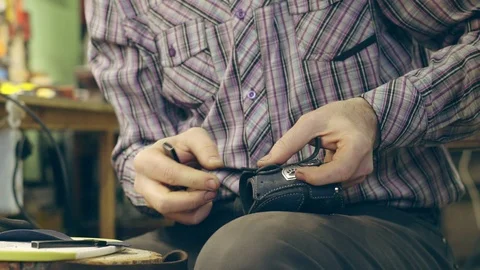 Tanner at work in the workshop Stock Footage 108897895