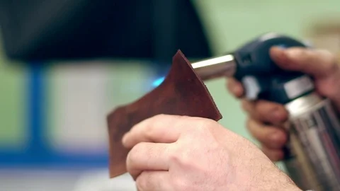 Tanner at work in the workshop 스톡 동영상 111751741