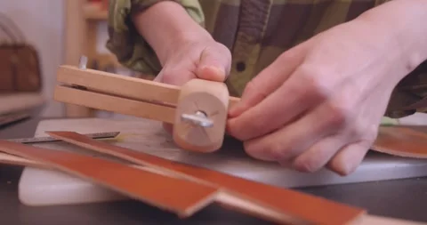 Tanner's hand with a knife, close up. side view. Stock Footage 303108117