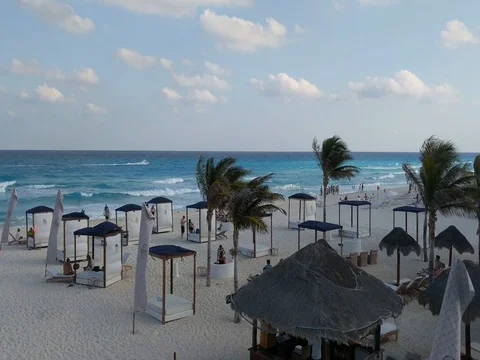 Tanning Beds on Beautiful Sandy Beach with Turquoise Ocean Stock Footage 73974596
