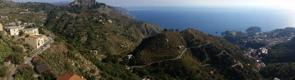 Taormina panorama of Mediterranean nature and coastline Stock Photos