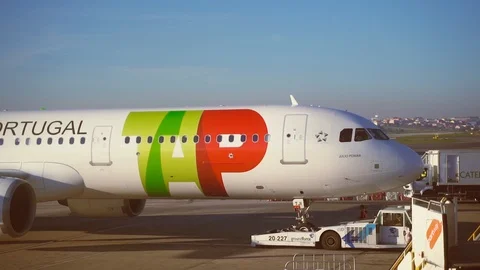 Tap airplane moving backwards undocking from jet bridge Stock Footage 110817008