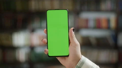 Tap to Click on Centre of Screen. Back View of Man at Phone with Green Screen Stock Footage 208077633