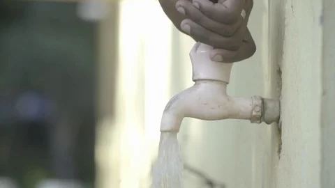 Tap closing close up slow motion wastage pollution Stock Footage 129927149