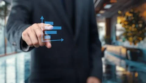 Tap the graph chart icon to view the data trends and performance metrics Stock Photos