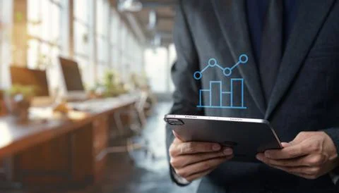 Tap the graph chart icon to view the data trends and performance metrics Stock Photos