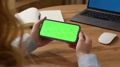 Tap horizontal cell phone, click press middle center green screen display office Stock Footage 319299822