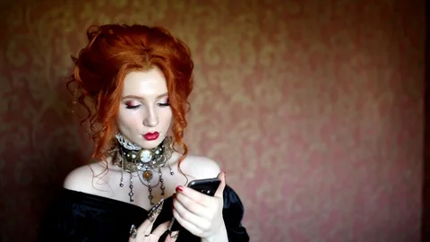 Tap message on new smartphone. Dark halloween attire. Stock Footage 116555412