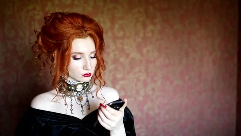 Tap a message on new smartphone. Gothic woman with pale skin Stock Footage 115284448