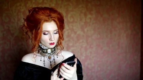 Tap a message on new smartphone. Gothic woman talk Stock Footage 116556646