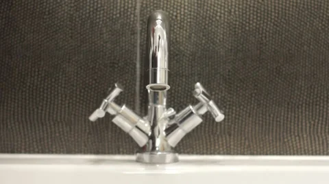 Tap water on black background Video stock 33329560