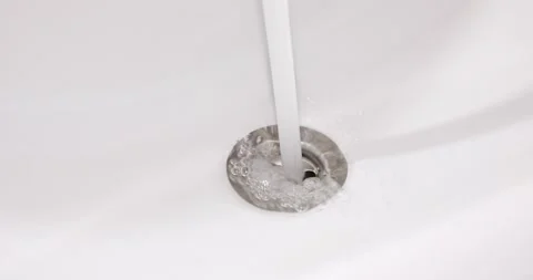 Tap water flows into the sink Stock Footage 170725697