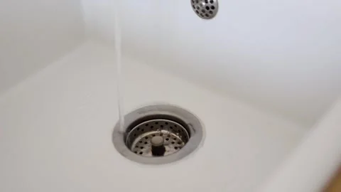 Tap Water flows into the sink Improper use of water in household duties  Stock Footage 251355057