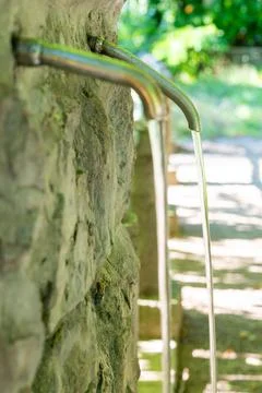 Tap from which water flows. Stock Photos