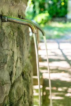 Tap from which water flows. Stock Photos