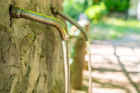 Tap from which water flows. Stock Photos