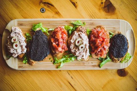 Tapas on crusty Bread Stock Photos