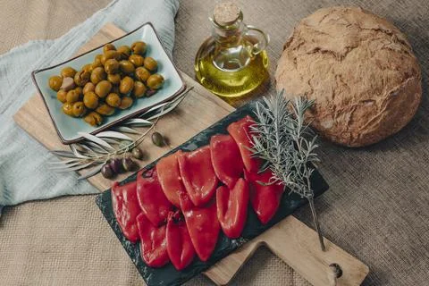 Tapas on Crusty Bread - Selection of Spanish tapas served on a sliced baguette. Stock Photos