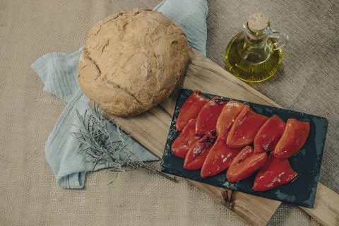 Tapas on Crusty Bread - Selection of Spanish tapas served on a sliced baguette. Stockfoto's
