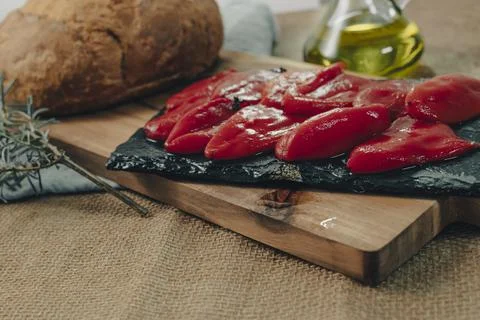 Tapas on Crusty Bread - Selection of Spanish tapas served on a sliced baguette. Stock Photos