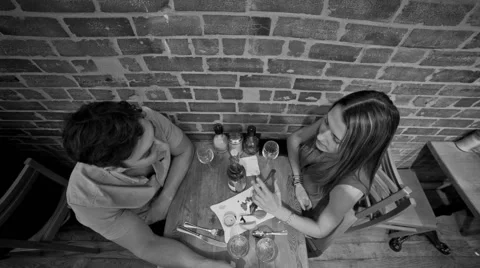 Tapas Date in Black and White - Man and Woman - Couple in Restaurant Stock Footage 40029899