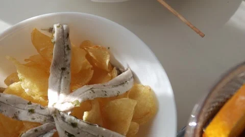 Tapas with Gildas and Boquerones served with crispy chips in a vibrant Stock Footage 301850410